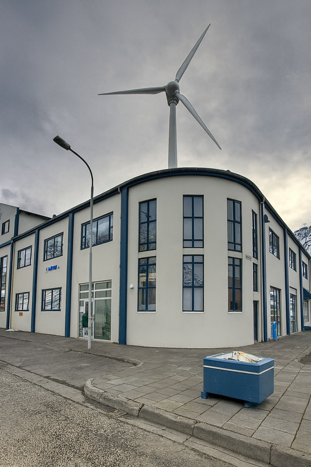 According to AI, this is what a wind turbine will look like on top of Vestrahús. The truth is that t…