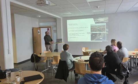 Guests listen with interest during the weekly lunch lecture